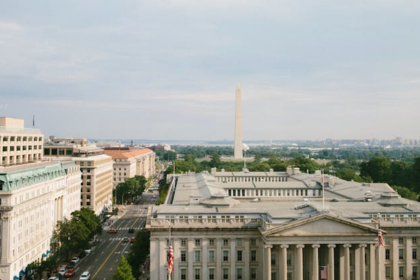 View of the buildings, the street and the Washington Monument