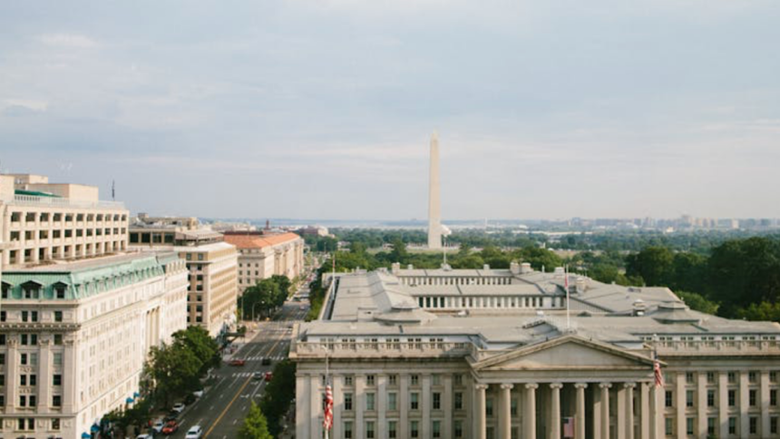 View of the buildings, the street and the Washington Monument