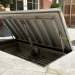 Hidden Passages for Heavy Things: Why Buildings Use Floor Hatches