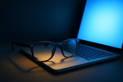 Blue light glasses reflecting computer screen to illustrate digital eye strain prevention