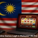 Laptop displaying online gaming website with Malaysian flag highlighting gaming legitimacy inquiry