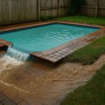 Improper pool drainage flooding backyard, causing property damage and costly repairs