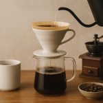 French press and pour-over coffee setup with fresh beans and mugs on a kitchen countertop