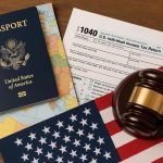 U.S. tax forms and passport on a desk, highlighting tax requirements for Americans abroad