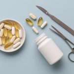 Bottles of pre-surgery supplements recommended by plastic surgeons on a clinic countertop