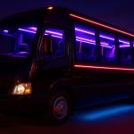 Luxury party bus interior with colorful lights and seating, highlighting group celebration benefits
