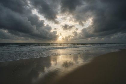 Calm landscape with scattered debris under clearing skies after a severe storm