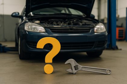 Car mechanic working on vehicle in Virginia Beach auto repair shop, tools and garage visible