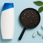 Bottles of anti-dandruff shampoo with key ingredients for treating scalp conditions