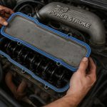 7.3 Powerstroke valve cover gasket replacement with tools and engine components visible