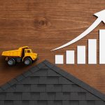 Roofing business broker analyzing company data to increase roofing business valuation