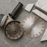 Marble cutting blades arranged on a workbench, showcasing types and features for professionals