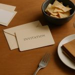 Empty chairs and untouched table settings at an uninviting gathering space indoors