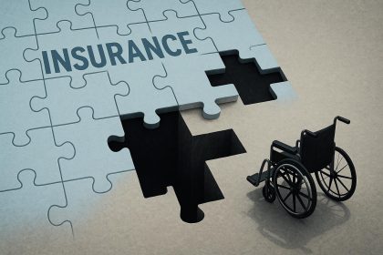 Broken wheelchair on cracked pavement symbolizing insurance gaps for catastrophic injury victims