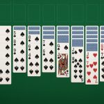 Spider Solitaire cards displayed on a digital screen with classic playing card layout and suits