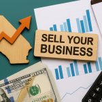 Business sale negotiation in Orange County office, highlighting strategies to maximize sale price