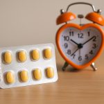 Cialis Daily pill bottle and calendar symbolizing spontaneous management of erectile dysfunction