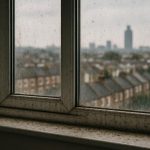 Dust and grime buildup on residential windows in South London neighborhoods
