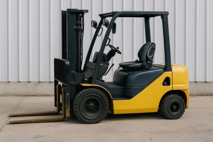 Yellow forklift parked at a construction site ready for temporary rental project use