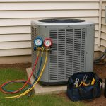Air conditioning unit technician repairing system covered by home warranty after breakdown